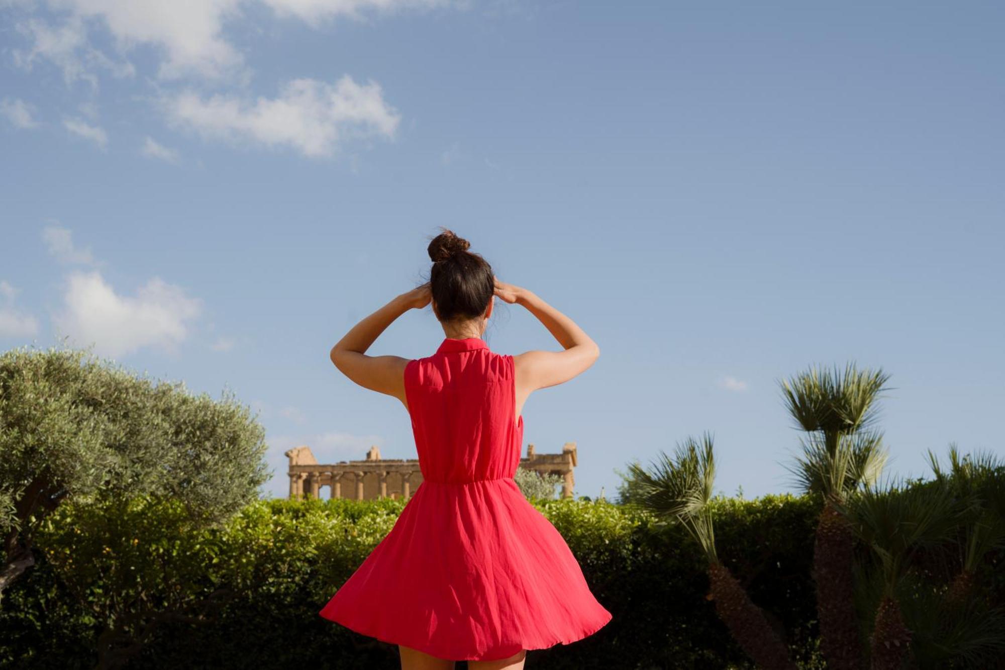 Villa Athena Resort Agrigento Bagian luar foto A woman wearing a red dress